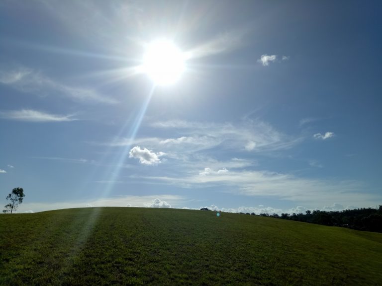 blue skies green field sunshine australia