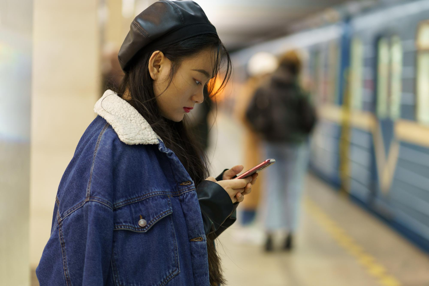 addicted from phone chinese girl pay no attention arriving train platform scroll social media
