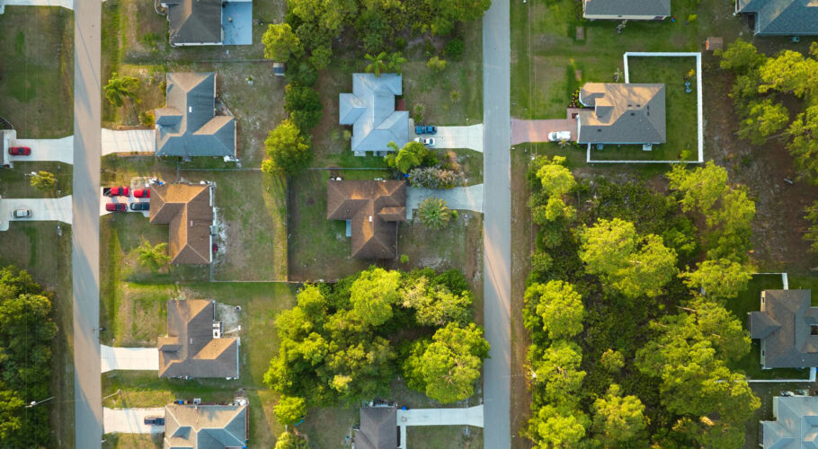 aerial view suburban landscape with private homes green palm trees quiet residential area