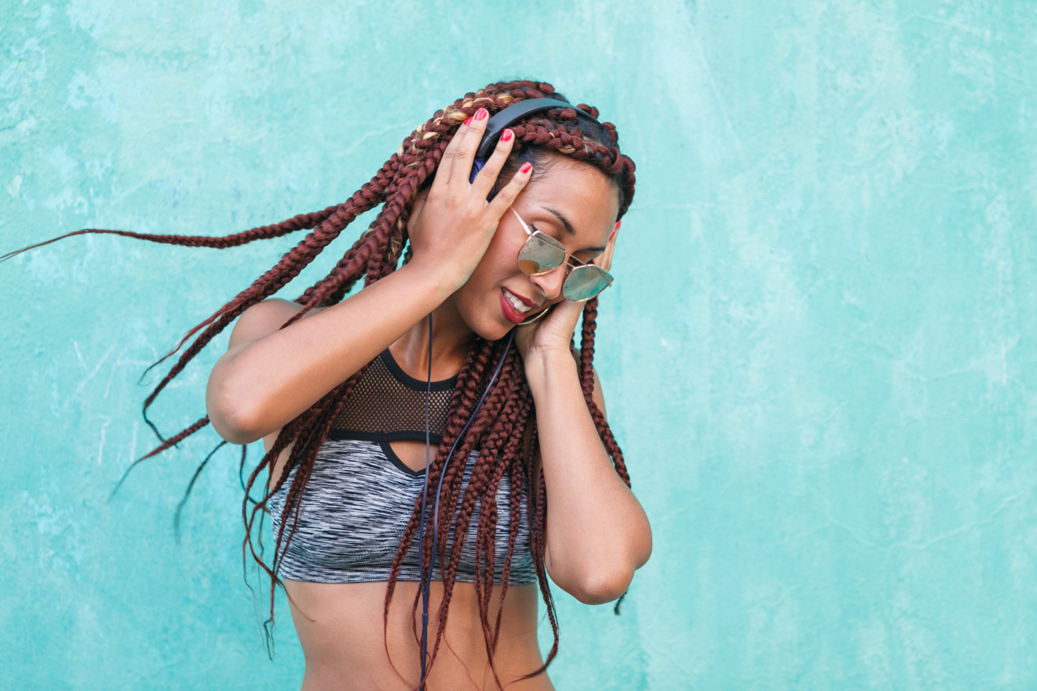 african american woman listening funky playlist her phone