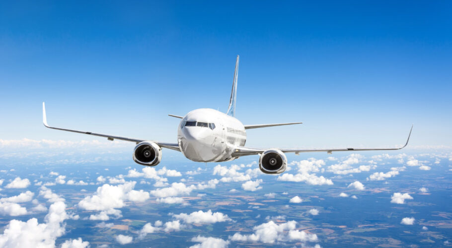 airplane flies summer clouds earth surface blue sky