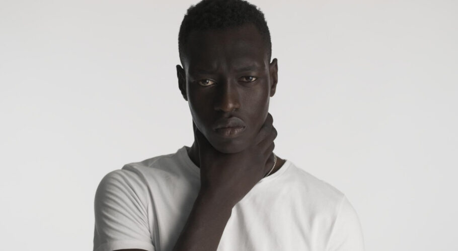 angry african american man holding hands neck looking aggressive