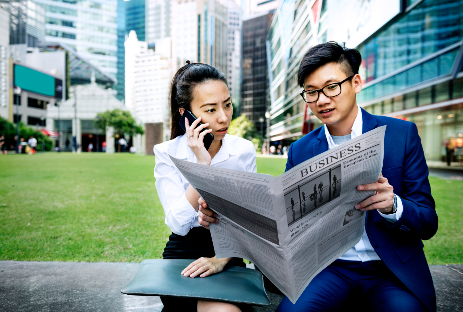 asian business people reading newspaper china entrepreneurs