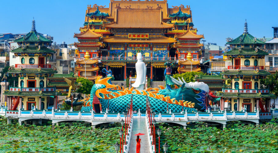 Chinese Asian woman in traditional dress walking to a Temple in Taiwan