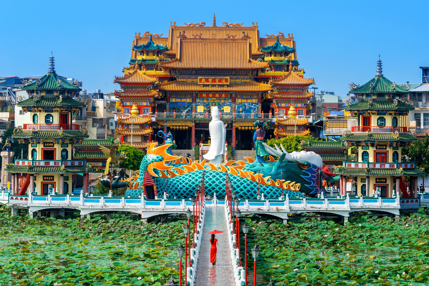 Chinese Asian woman in traditional dress walking to a Temple in Taiwan