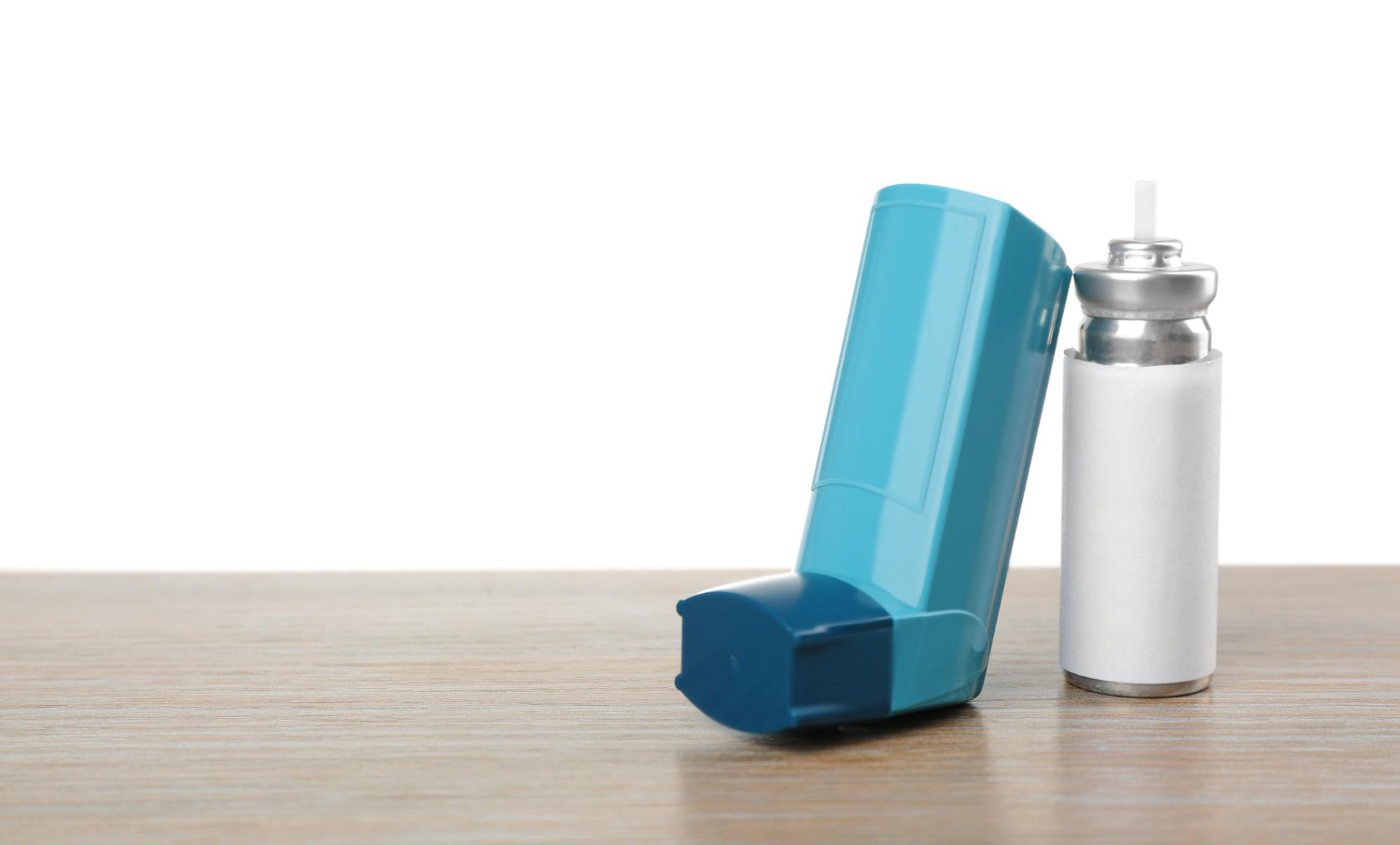 asthma inhaler wooden table