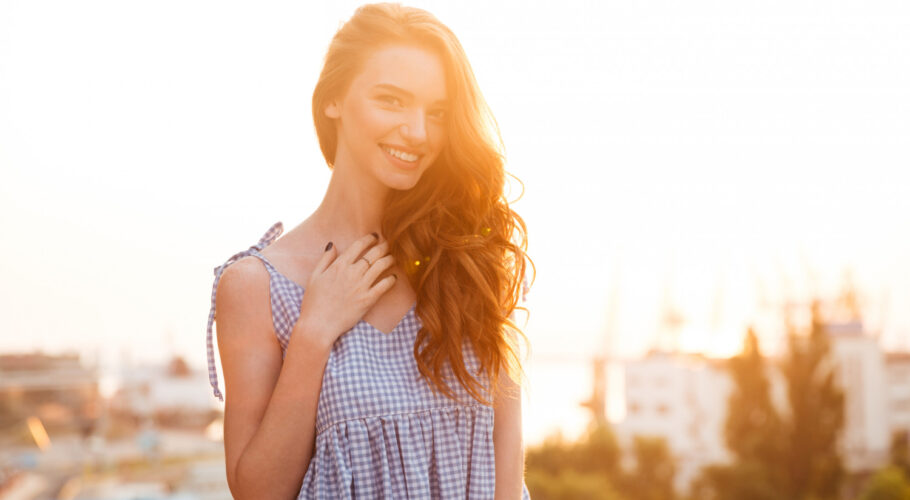 attractive smiling redhead ginger girl in dress
