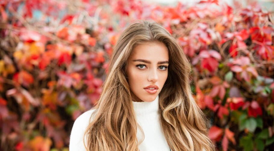 autumn beauty woman fashion wodel with fall maple leaf outdoors lyssa