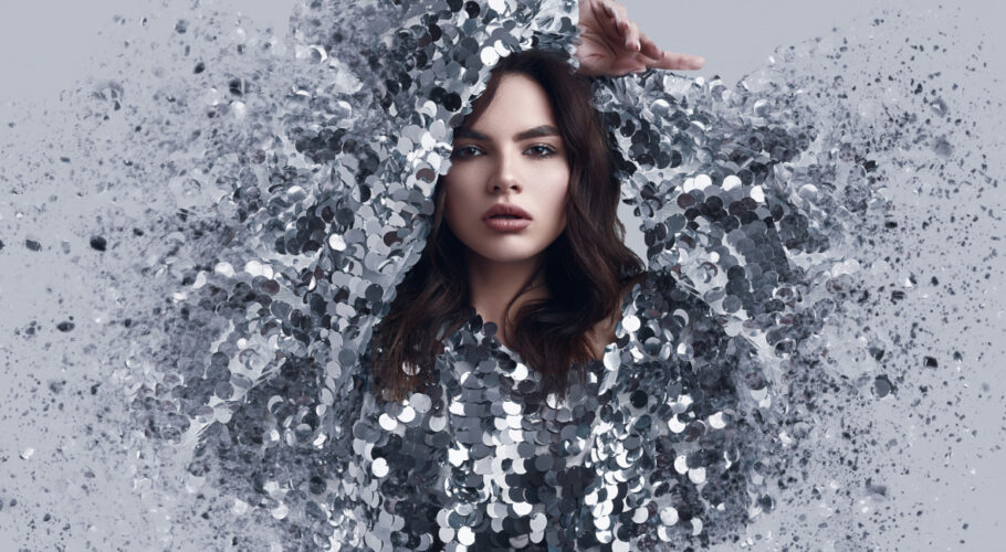 beautiful brunette woman fashion dress sequins with dispersion effect