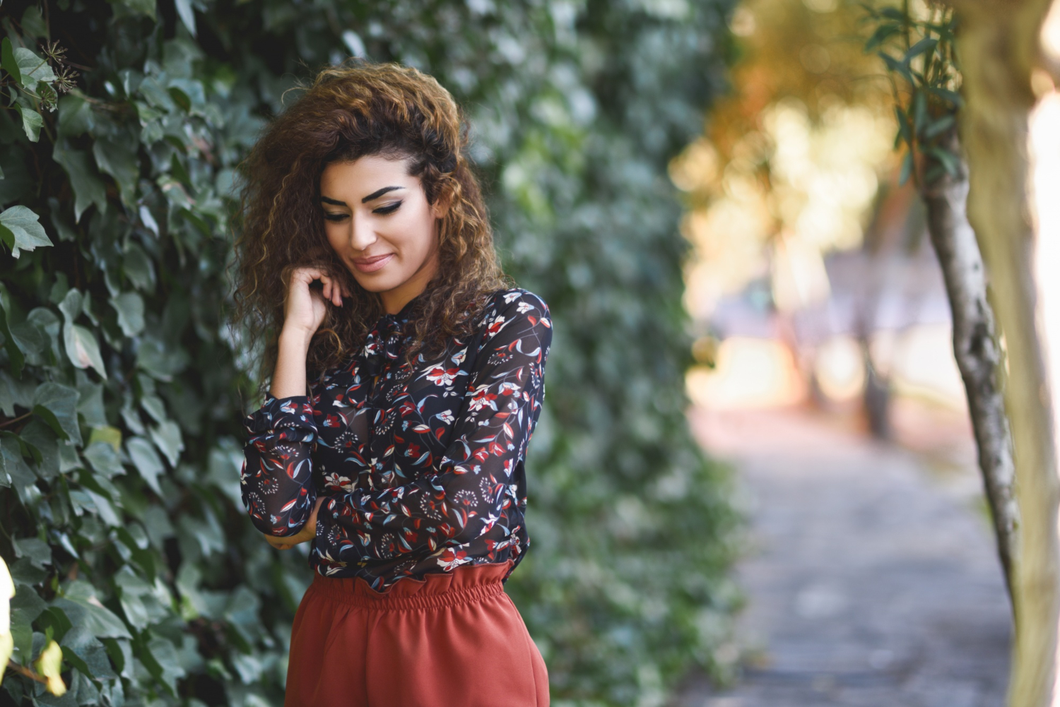 beautiful young arabic woman with black curly hairstyle