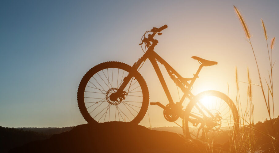 biking leisure black sky riding in the open