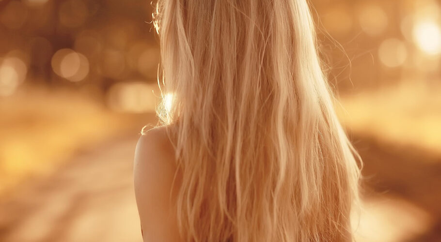 blonde long hair nature summer happy adult girl with developing wind long blonde hair jewell summer field