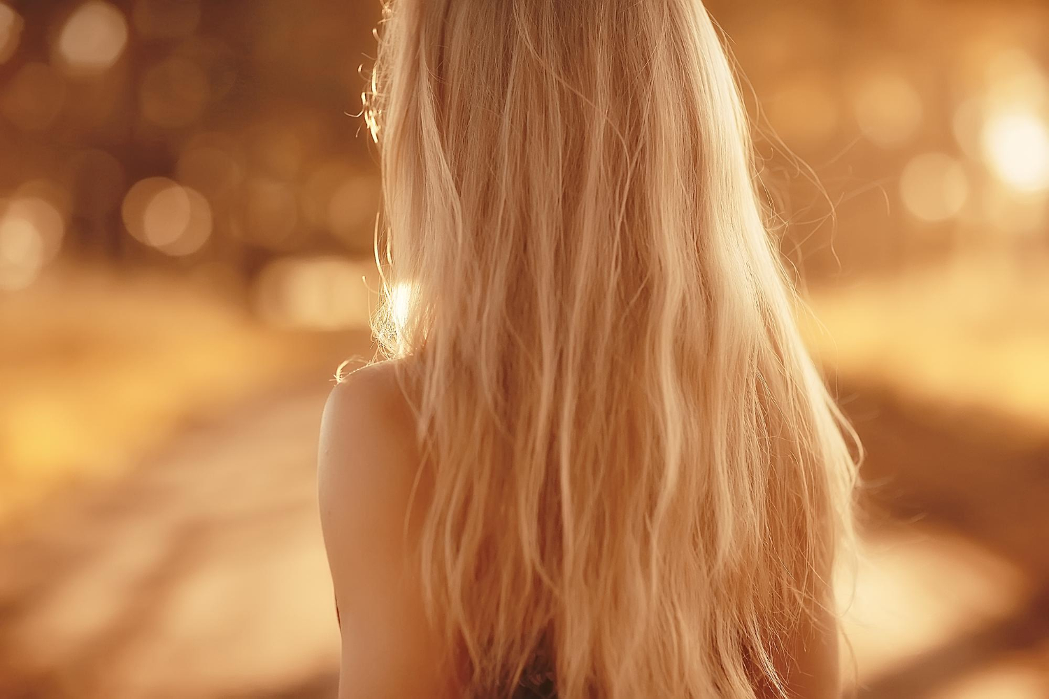 blonde long hair nature summer happy adult girl with developing wind long blonde hair jewell summer field