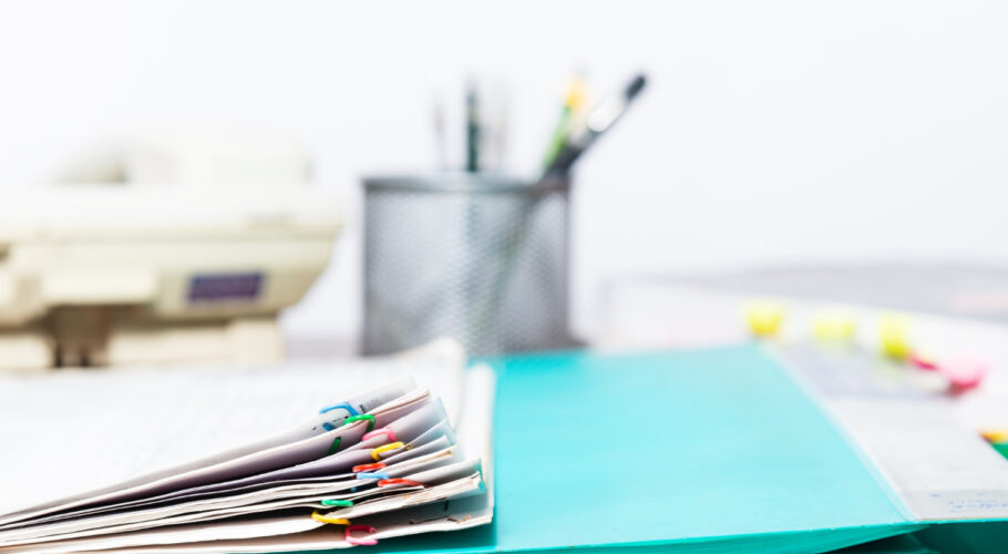 blurred background document paper files folder office and desk