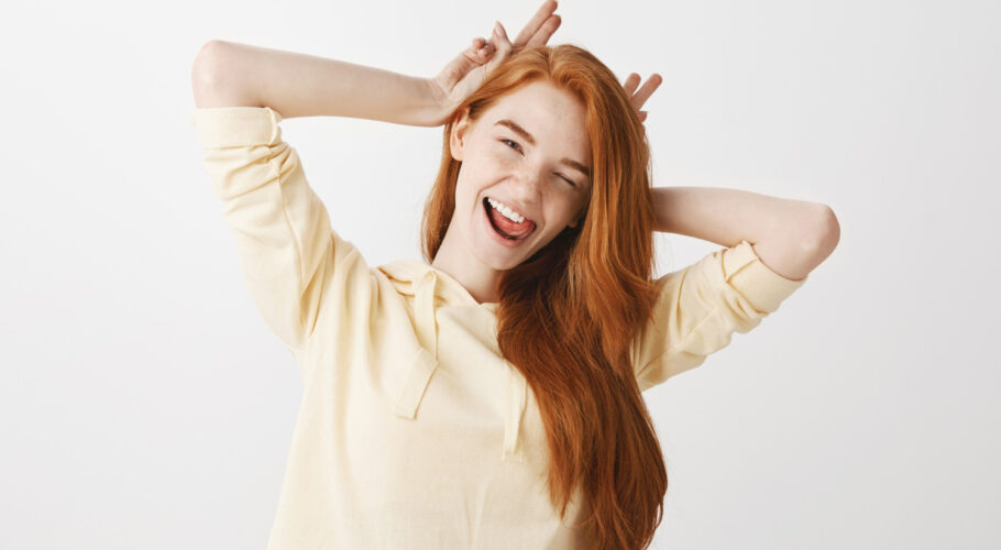 carefree redhead girl having fun smiling winking kathryn
