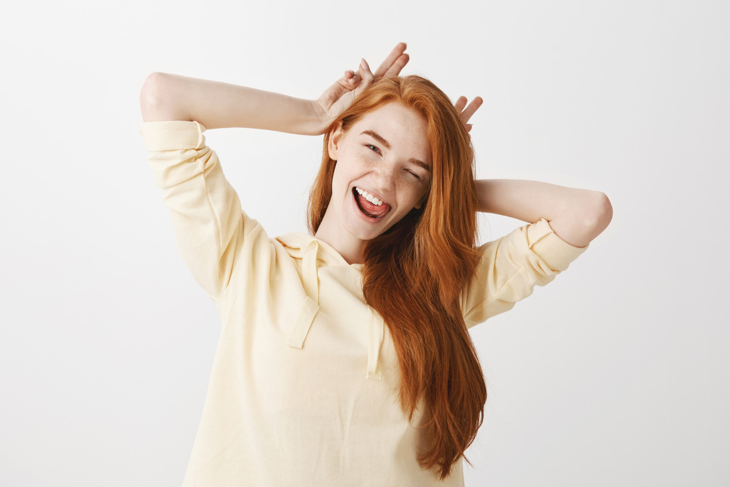 carefree redhead girl having fun smiling winking kathryn