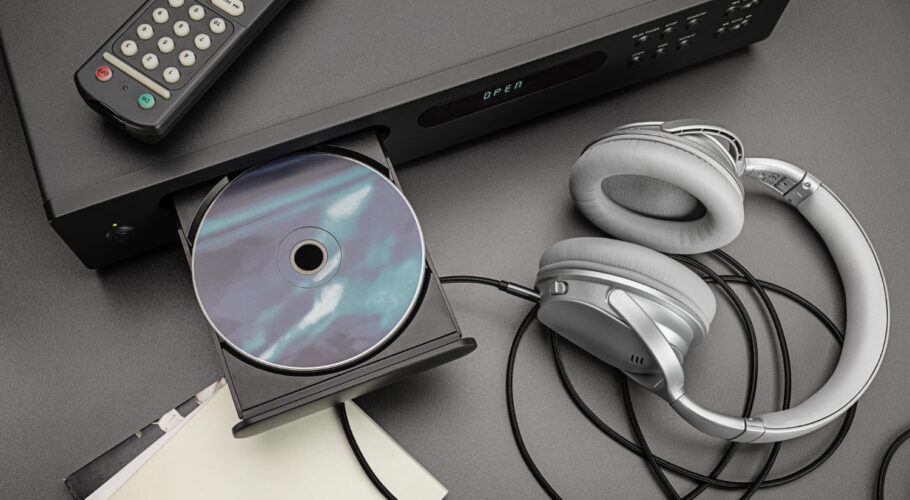 cd player cable remote headphones listening music open cd tray studio shot