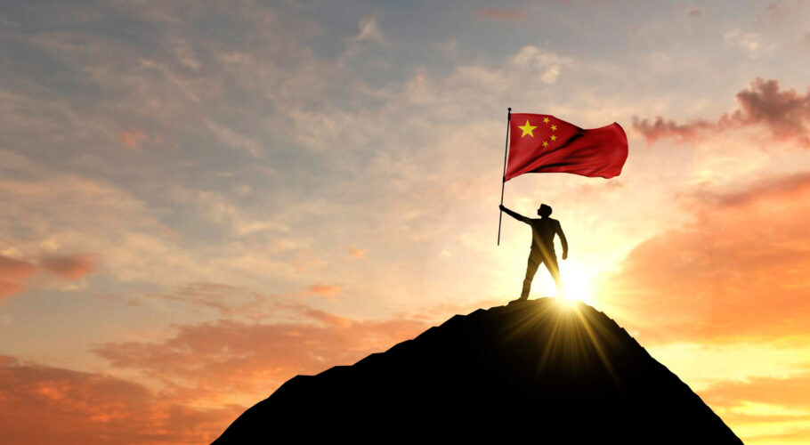 chinese flag being waved top mountain summit patriotic