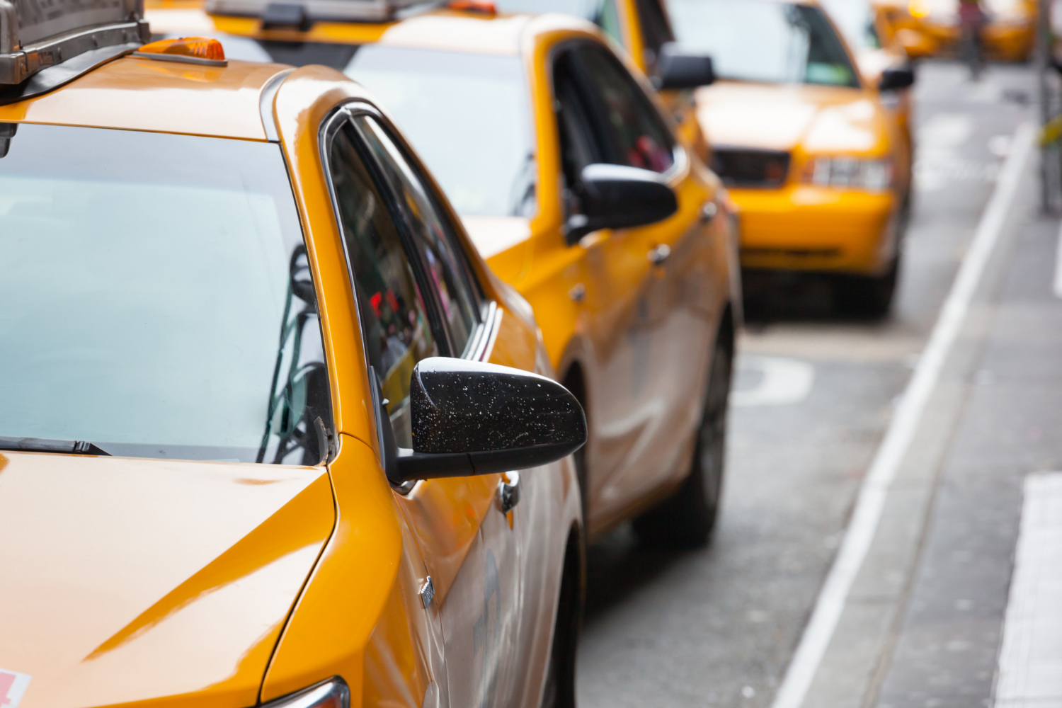 classic street view of taxi cabs waiting to pick up customers