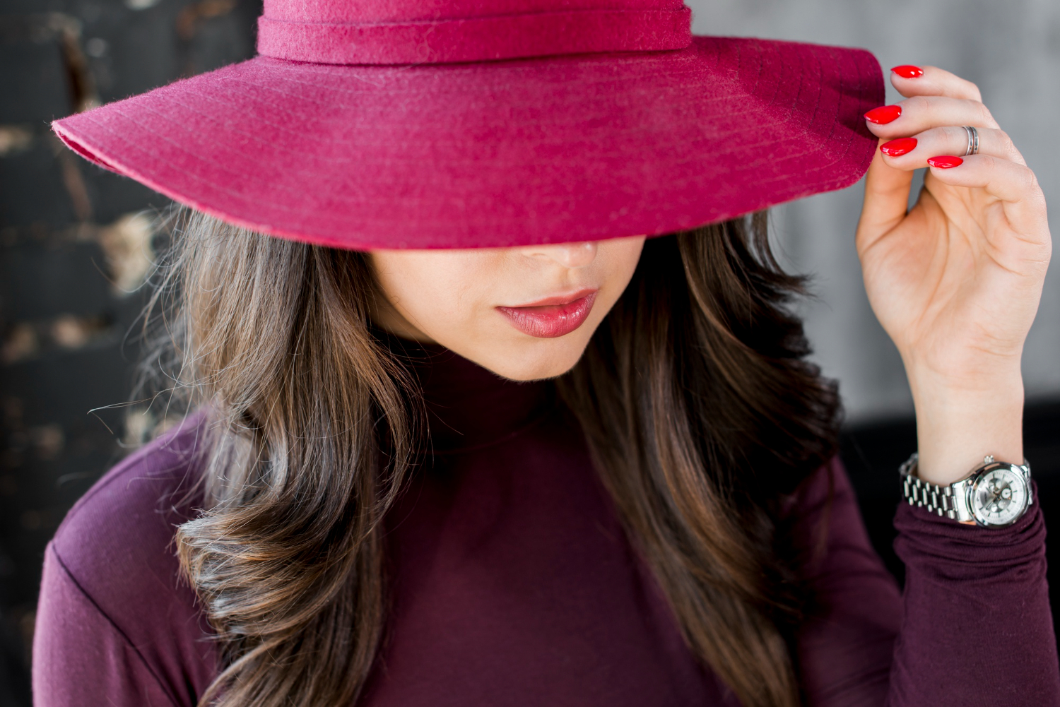 close up beautiful young woman with pink hat red polo neck