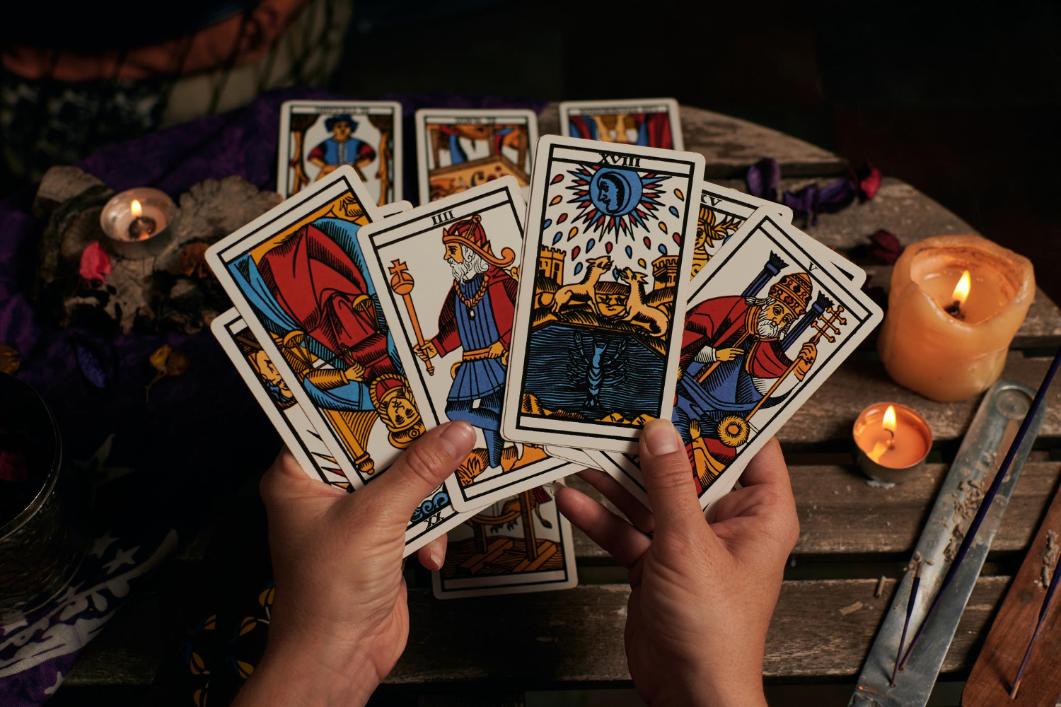 close up fortune teller reading tarot cards