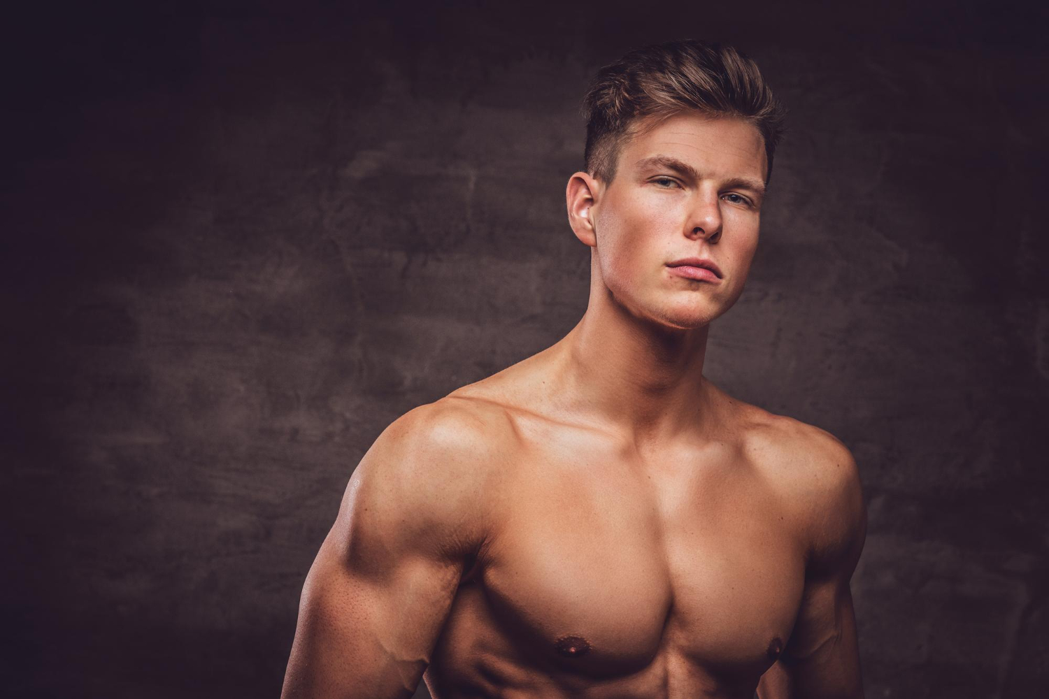 close up portrait sexy shirtless young man model with muscular body stylish haircut
