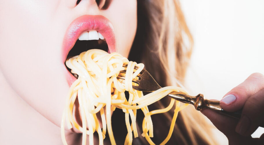 close up sexy lips with noodles pasta female mouth eat spaghetti