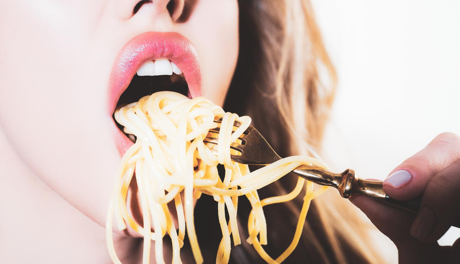 close up sexy lips with noodles pasta female mouth eat spaghetti