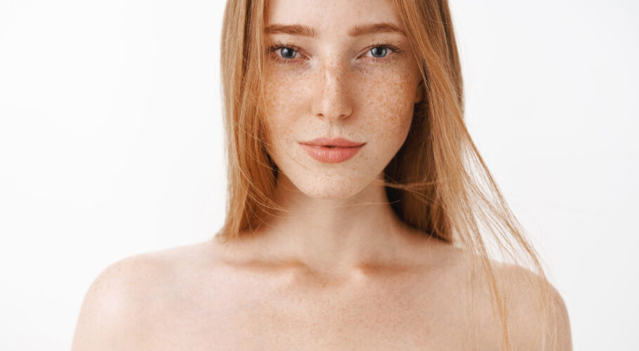 close up shot attractive feminine naked jewell redhead woman with freckles