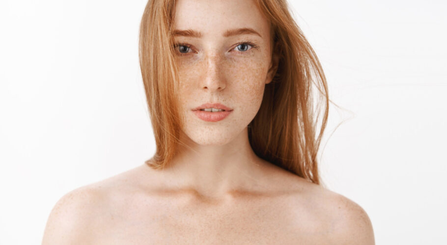 close up shot sensual feminine attractive redhead female standing naked