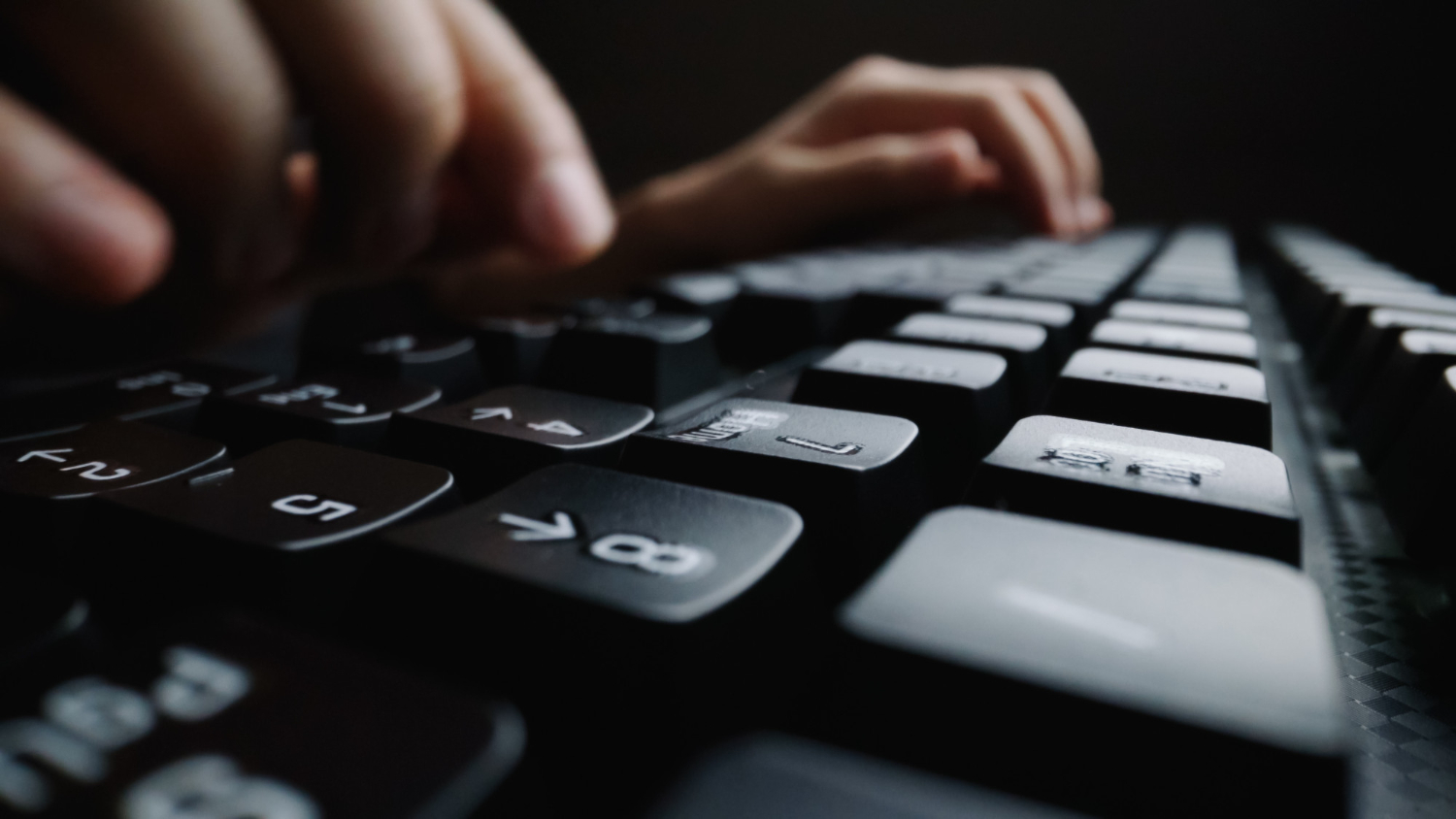 close up soft focus finger typing keyboard