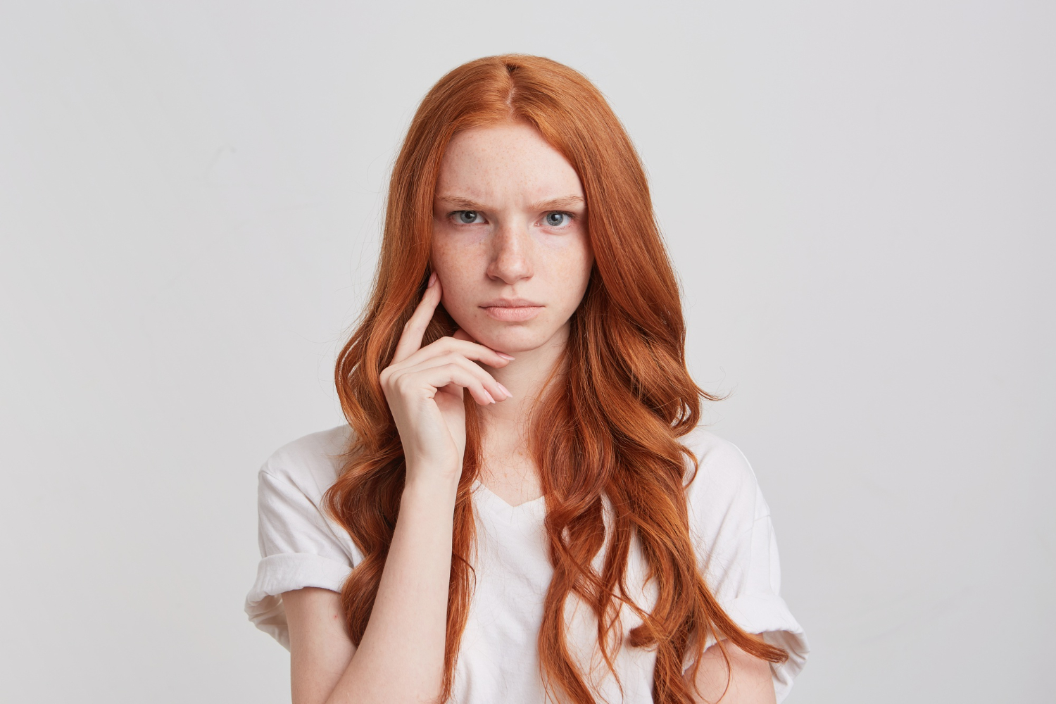 closeup depressed upset redhead young woman kathryn with long wavy hair redhead