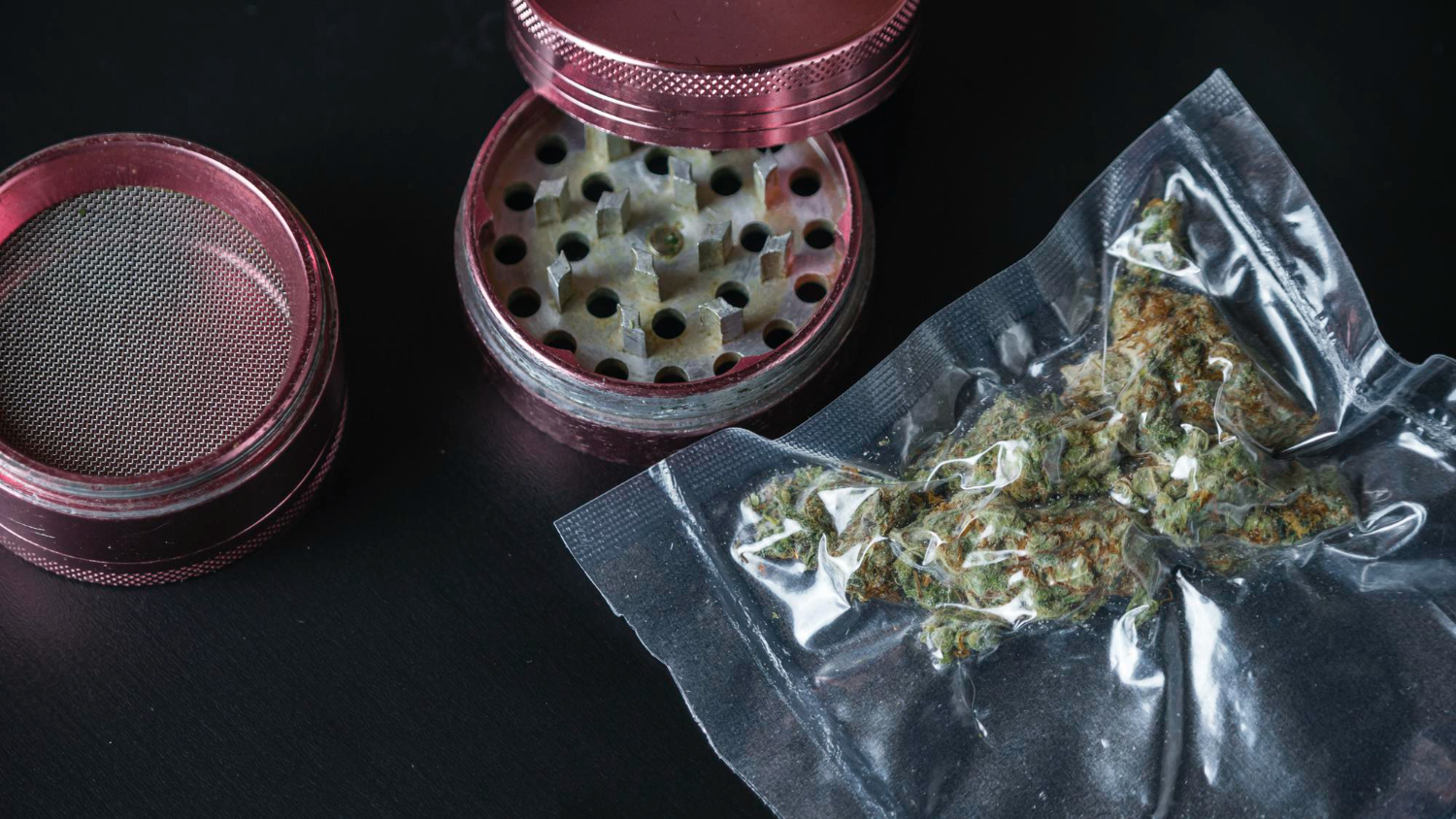closeup medical marijuana buds vacuum seal bags grinder