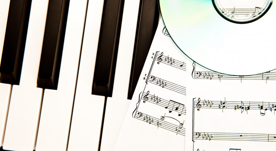 compact disc music scores placed piano