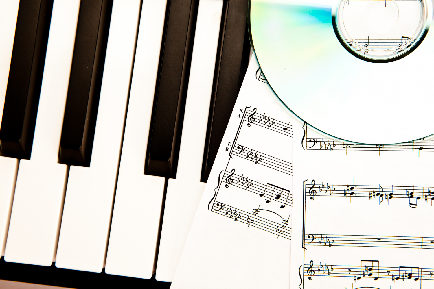 compact disc music scores placed piano