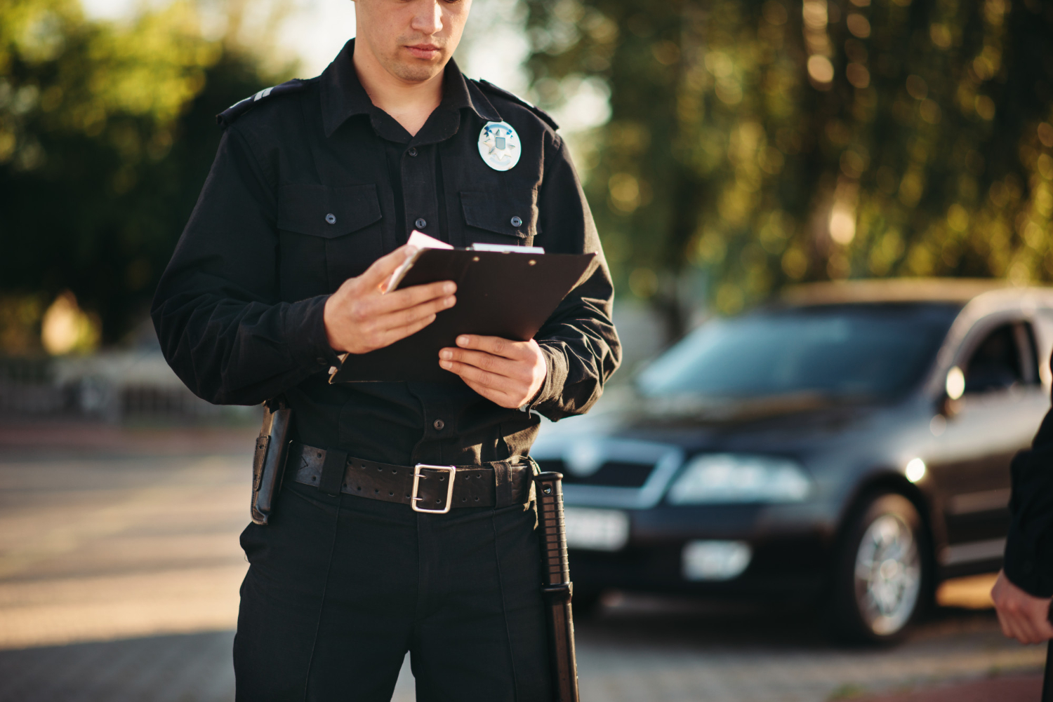 cop with notebook comes in to check domestic dispute