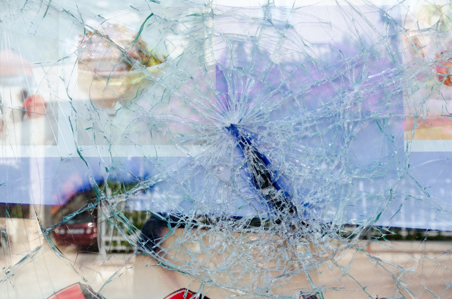 cracked broken glass window looking to the street outside