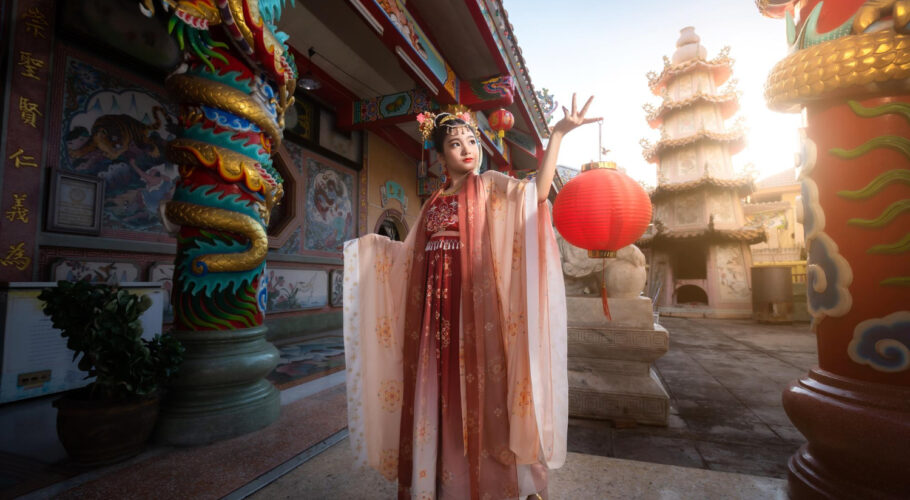 cute little asian girl wearing chinese costumes decoration hold paper lanterns