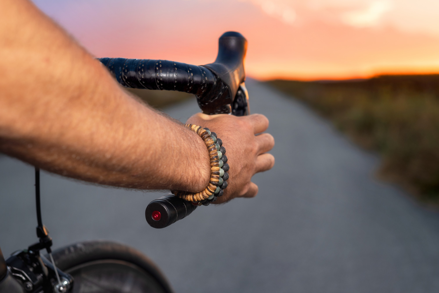 cyclist riding bycicle sunset pov view