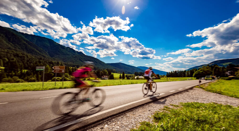 cyclists riding bicycle road background up mountain warning authentic shooting there is motion blur