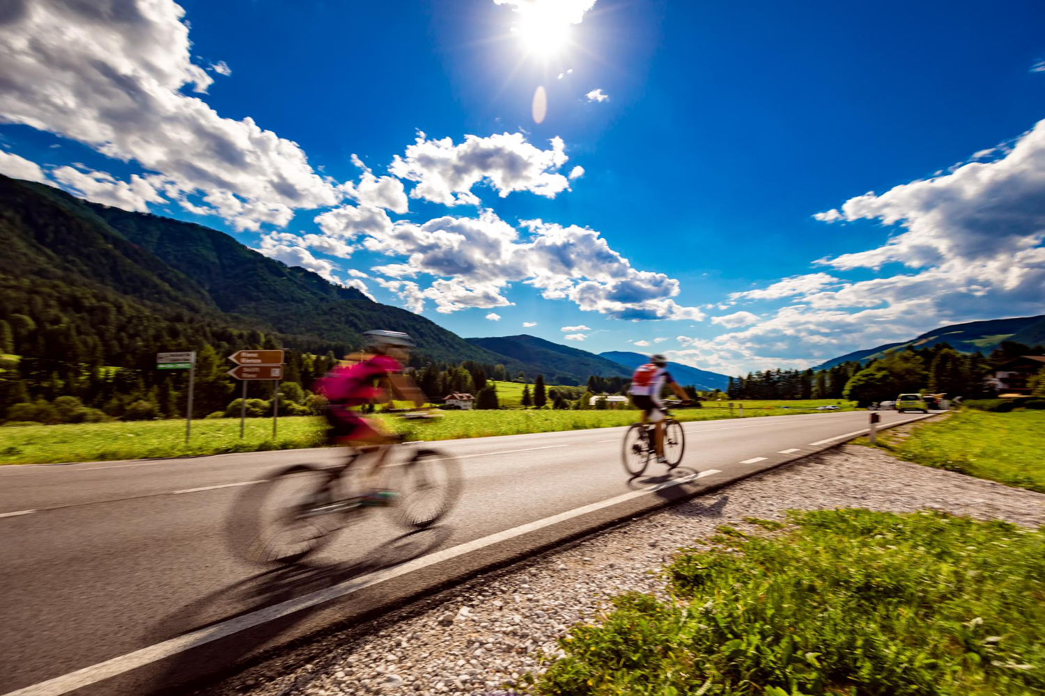 cyclists riding bicycle road background up mountain warning authentic shooting there is motion blur