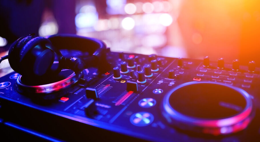 dj remote controller nightclub perspective with professional headphones