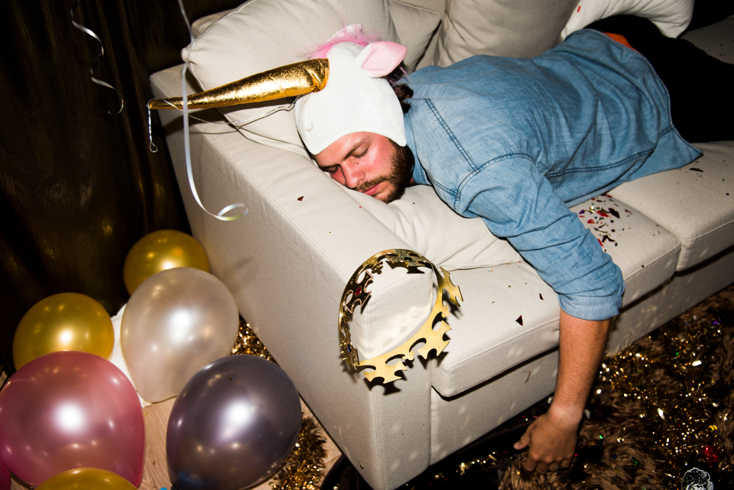 drunk people at a party fallen asleep on couch