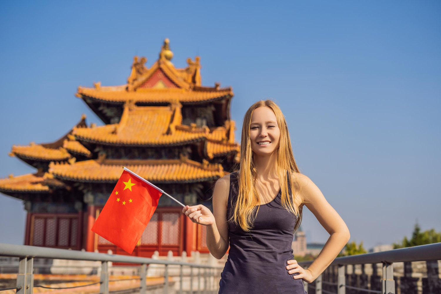 enjoying vacation china young woman with national chinese flag forbidden city travel china