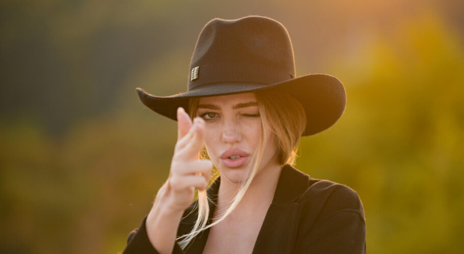 female hand gun gesture sensual portrait elegant young woman outdoors beautiful fashionable girl lyssa