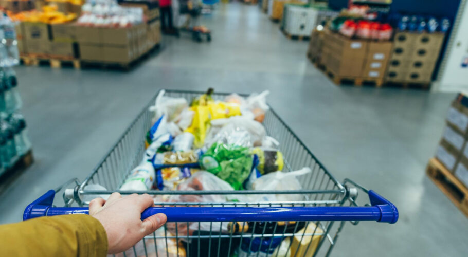 first person view man with trolley grocery store shopping