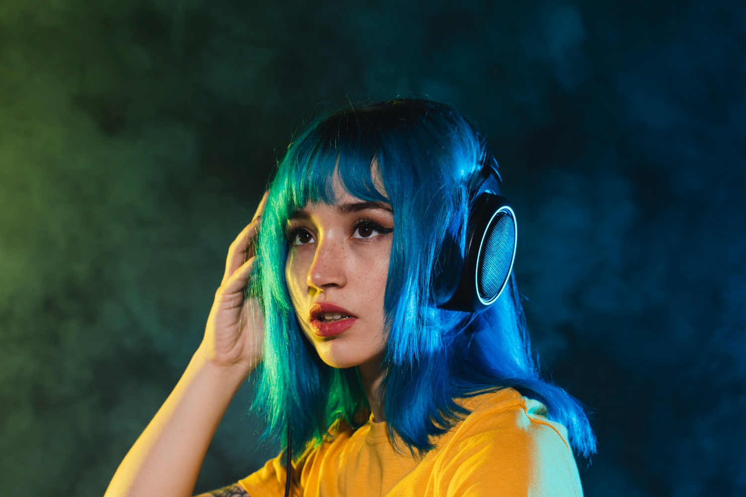 low angle woman in nightclub mixing music