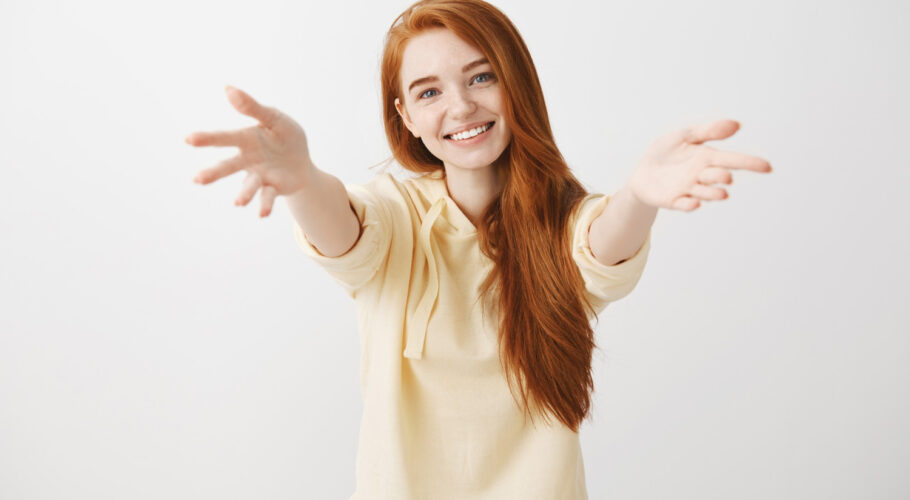 gorgeous smiling redhead kathryn girl reaching hands forward for a hug