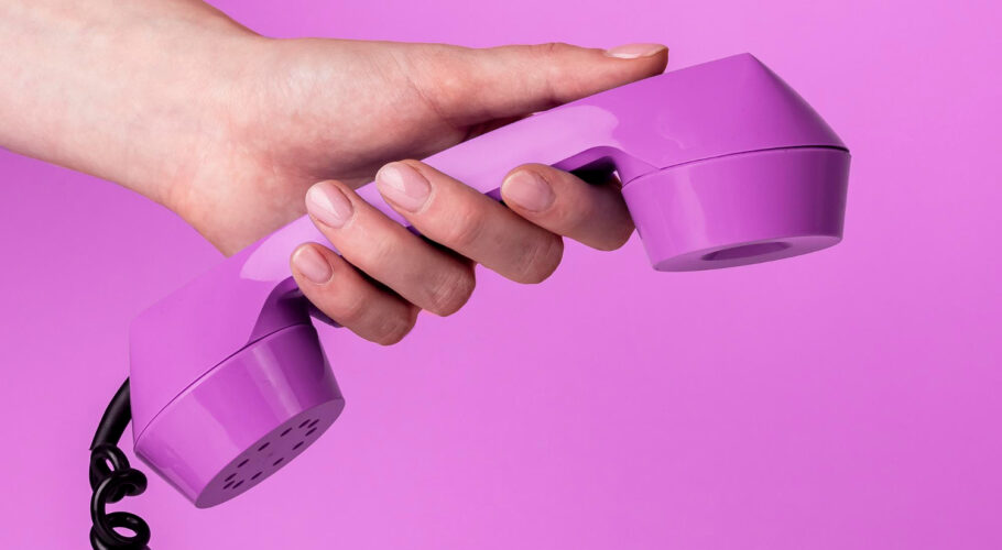 hand holding retro phone receiver trendy very