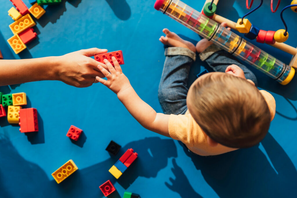 Happy Baby Toddler Playing With Toy Duplo Lego Blocks